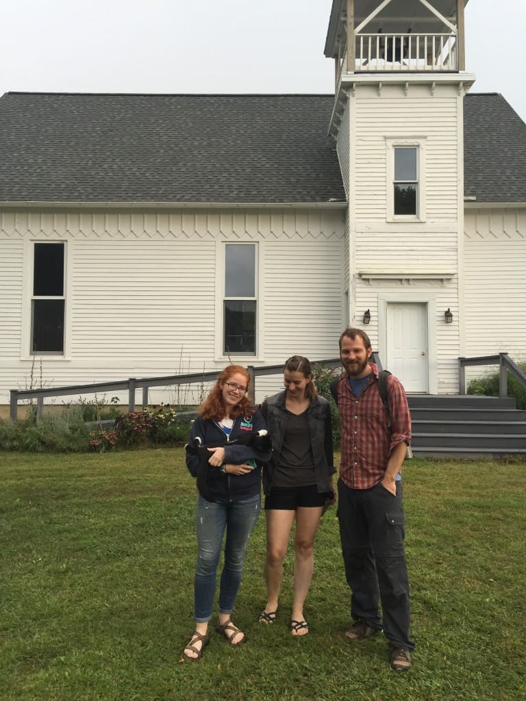 Some of the team in front of the restored church where we stayed, joined by a new furry friend.