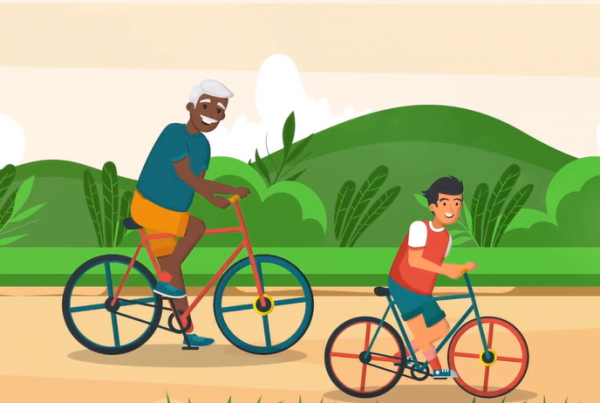 A still from PA Foundation's video; two people ride bikes together