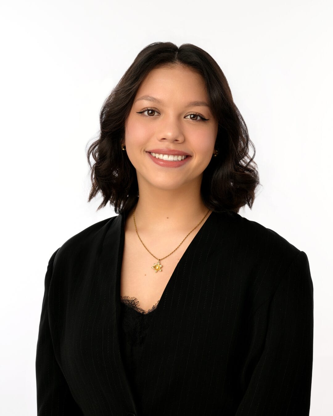 Photo of Brielle smiling; Brielle is the winner of the Next Day Animations Illustrating Awesomeness Scholarship for 2025.